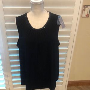 Chico’s dressy black tank with beaded neck line. Great look for the holidays. 🎉